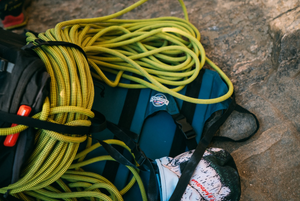 A crazy creek chair under rock climbing rope