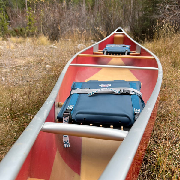 Canoe chairs strapped down and stored in a canoe
