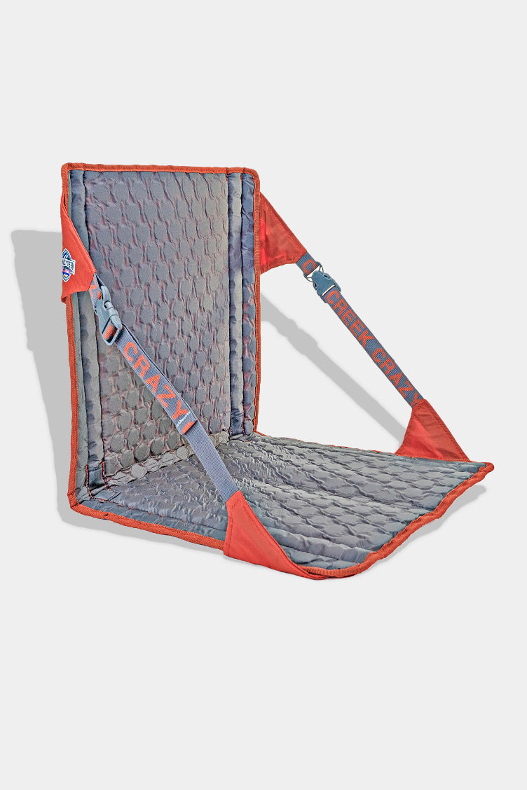 Gray and red backpacking chair on a white background