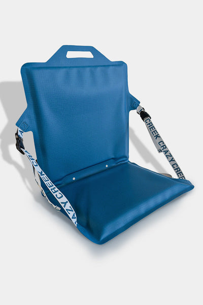 Blue folding chair for paddling on a white background