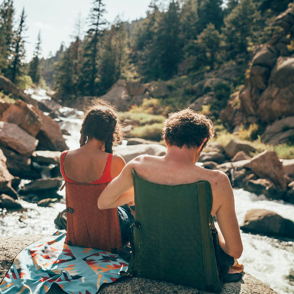 Couple Sitting in the mountains