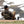 Man sitting in a camo chair on a snowy mountainside