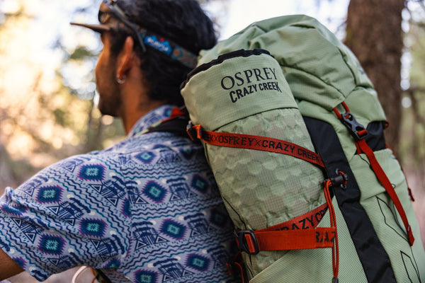 Closeup of the Crazy Creek and Osprey Collab chair rolled up and stowed in the side of the backpack