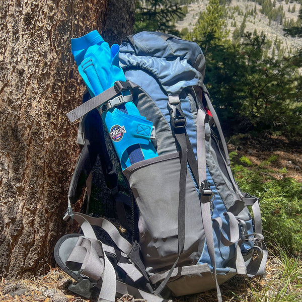 AirCliner chair rolled up and stored in the side pocket of a backpack