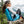 Woman sitting in the AirCliner inflatable chair on a tree stump on a mountain